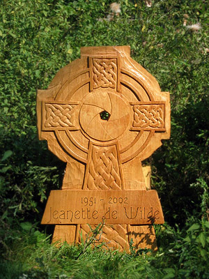 richly decorated oak Celtic-crosses made by sculptor and woodcarver