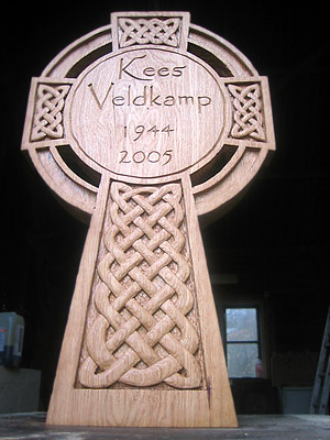 richly decorated oak Celtic-crosses made by sculptor and woodcarver