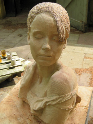 portrait bust made of solid wood instead of bronze, capturing both likeness and spirit