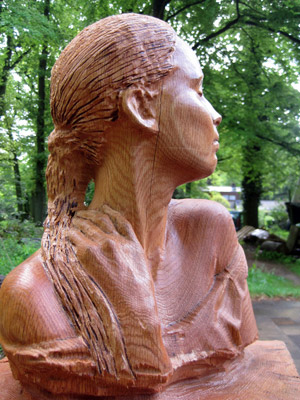 portrait bust made of solid wood instead of bronze, capturing both likeness and spirit